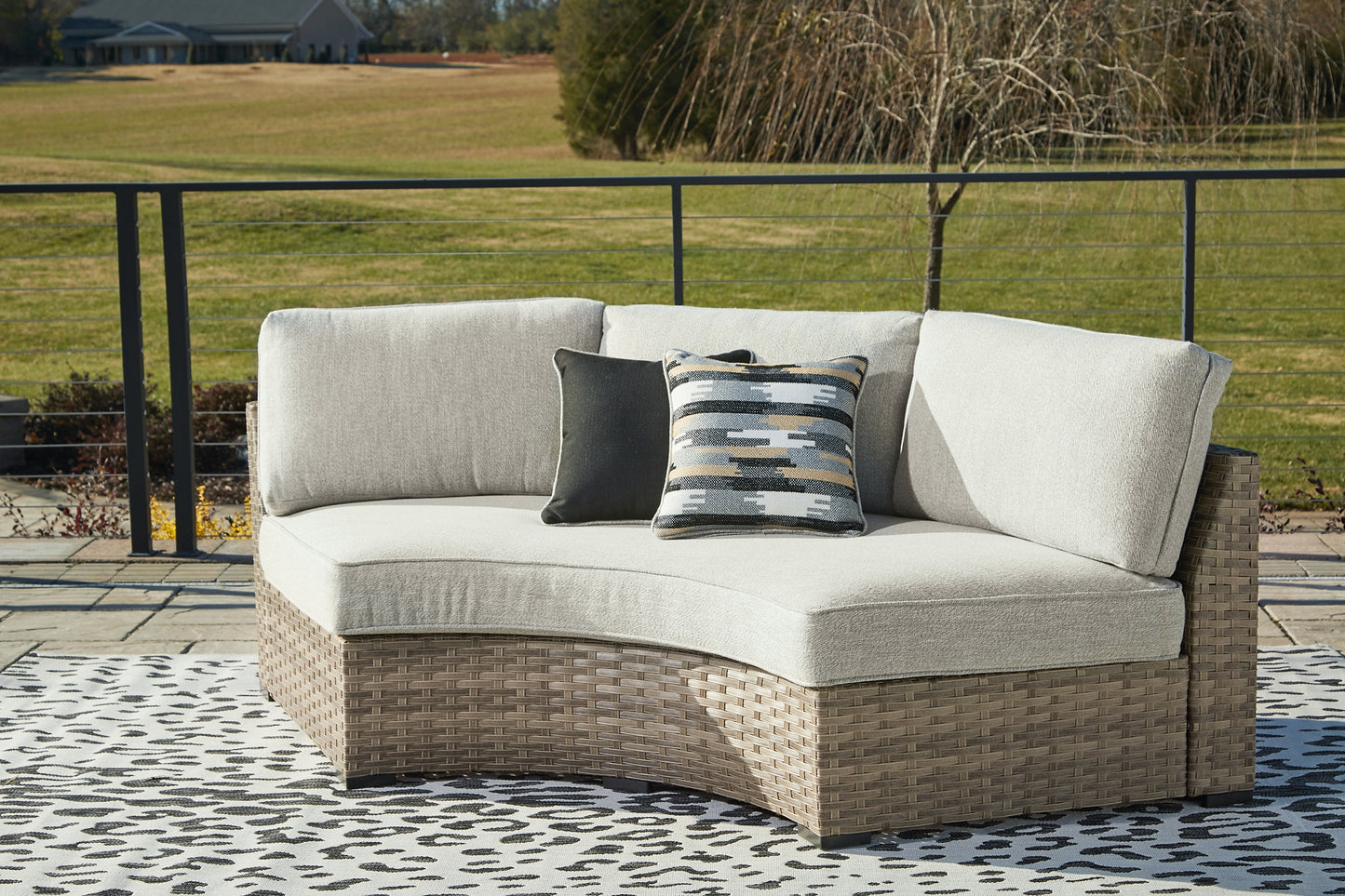 Calworth Curved Loveseat with Cushion